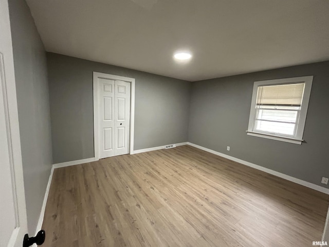 unfurnished room featuring light hardwood / wood-style floors