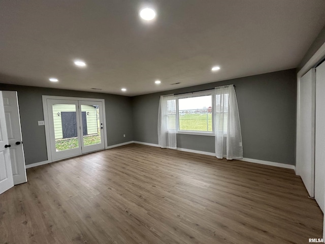 spare room featuring hardwood / wood-style floors