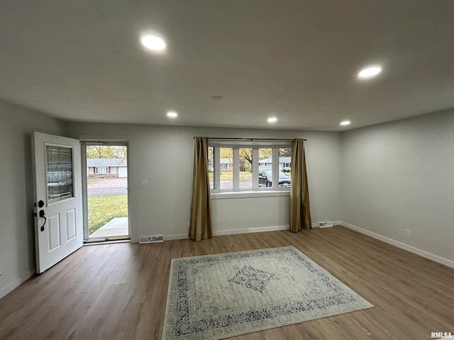 interior space featuring light hardwood / wood-style flooring and a wealth of natural light