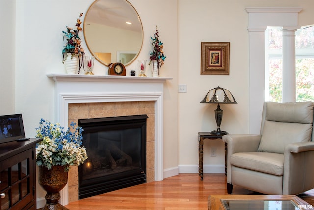 living area featuring a fireplace and hardwood / wood-style floors