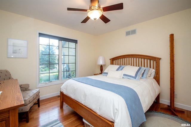 bedroom featuring ceiling fan and light wood-type flooring