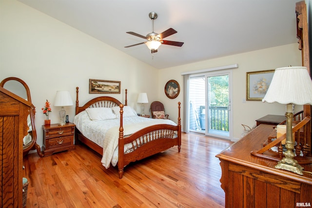 bedroom featuring light wood-type flooring, access to outside, vaulted ceiling, and ceiling fan