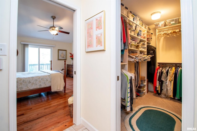 spacious closet featuring wood-type flooring and ceiling fan