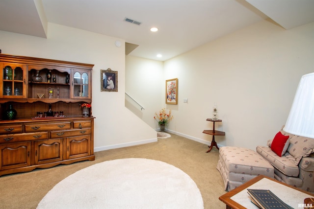 living area featuring light colored carpet