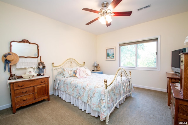 bedroom with ceiling fan and light colored carpet