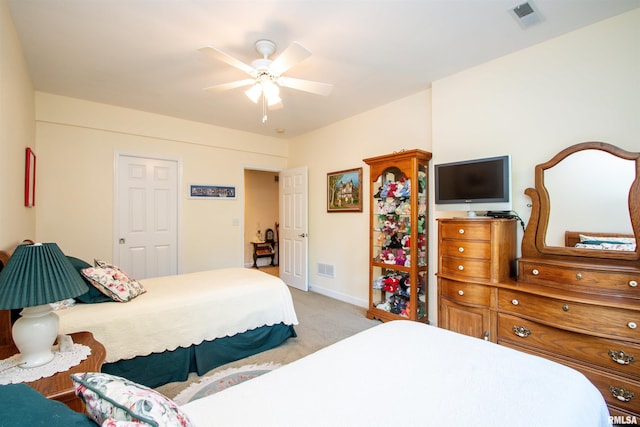 carpeted bedroom featuring ceiling fan