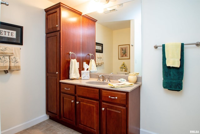 bathroom with tile patterned floors and vanity