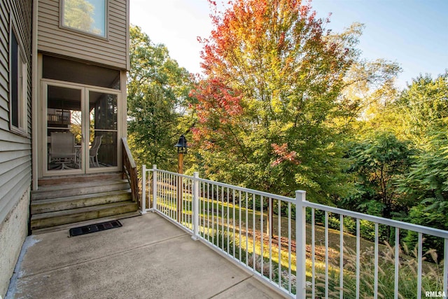 view of patio featuring a balcony