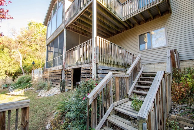 view of side of home featuring a sunroom