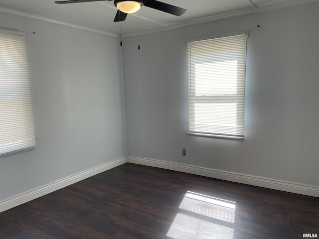 spare room featuring dark hardwood / wood-style flooring, ceiling fan, and ornamental molding