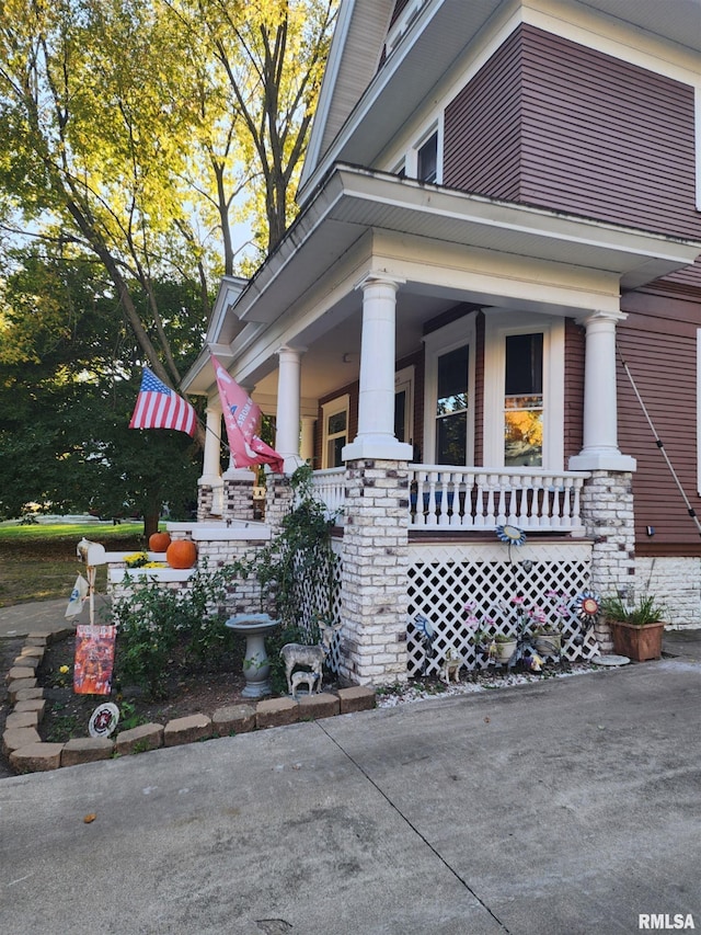 view of property exterior featuring a porch