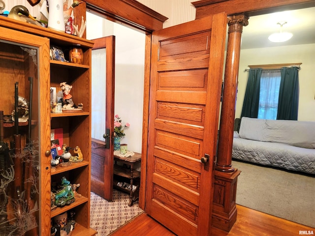 corridor with light hardwood / wood-style flooring