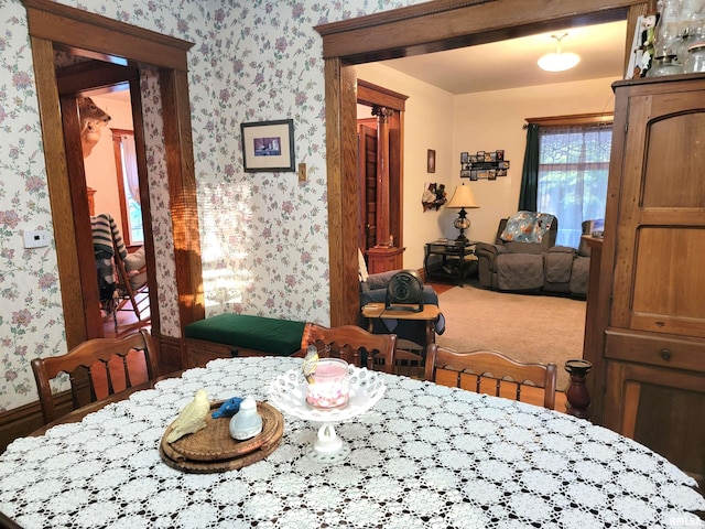 dining space featuring carpet flooring