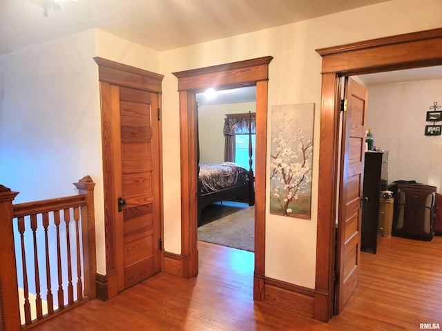 hall with wood-type flooring