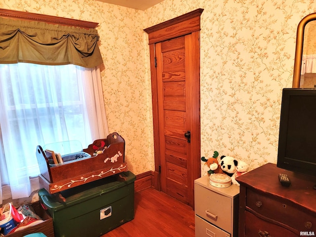 bedroom with dark wood-type flooring