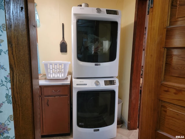 laundry area featuring stacked washer / dryer