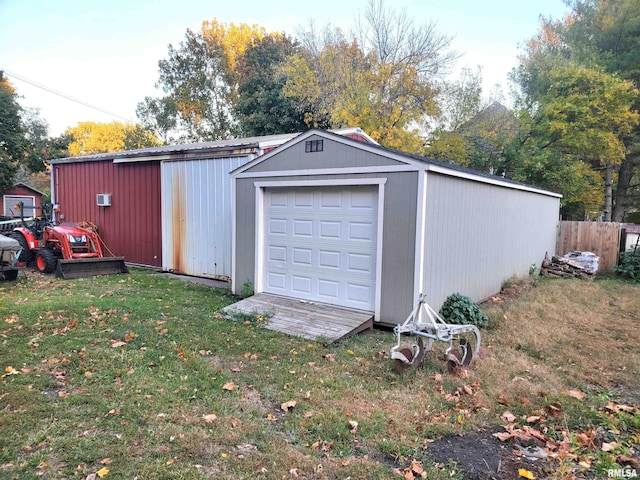 garage featuring a yard