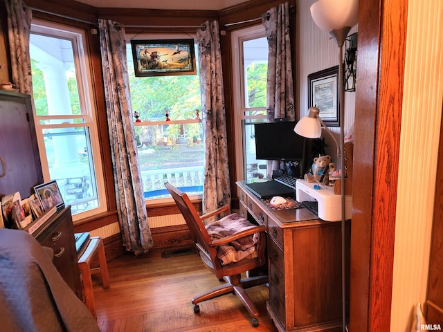 home office with hardwood / wood-style flooring