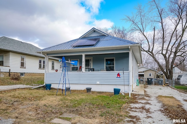 bungalow-style house with solar panels