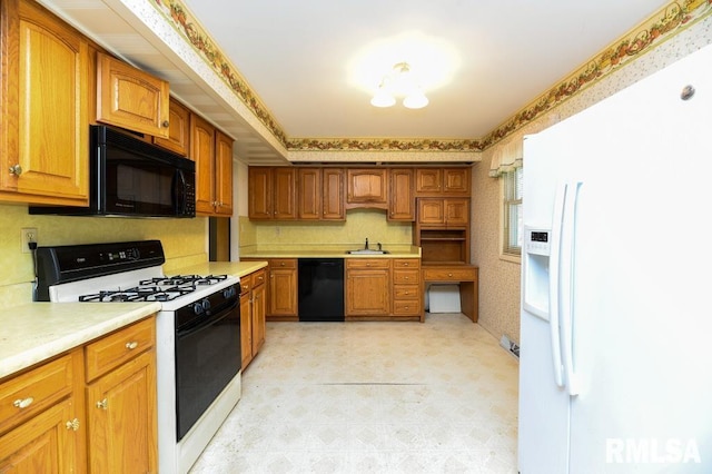 kitchen featuring sink and black appliances