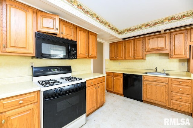 kitchen with black appliances and sink