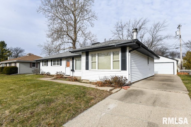 ranch-style home featuring an outbuilding, a garage, and a front lawn