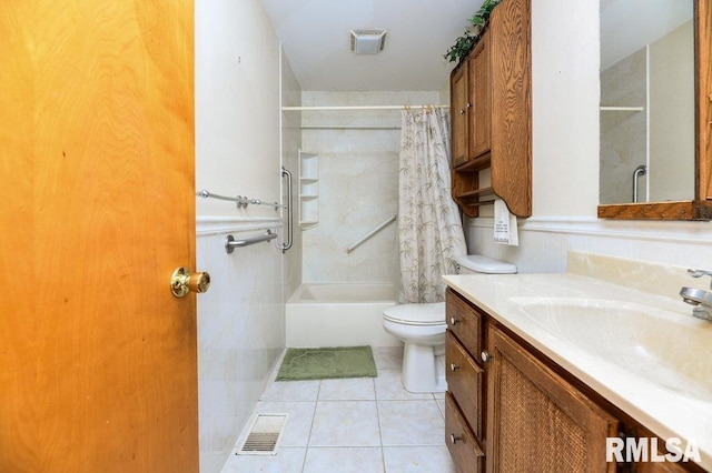 full bathroom featuring tile patterned flooring, shower / bath combo, vanity, and toilet