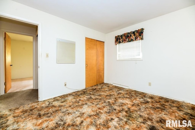 unfurnished bedroom featuring a closet and carpet