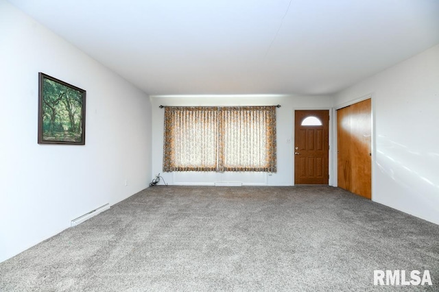 interior space featuring carpet flooring and baseboard heating