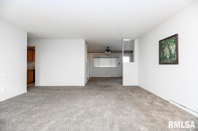 unfurnished living room featuring baseboard heating, light carpet, and ceiling fan