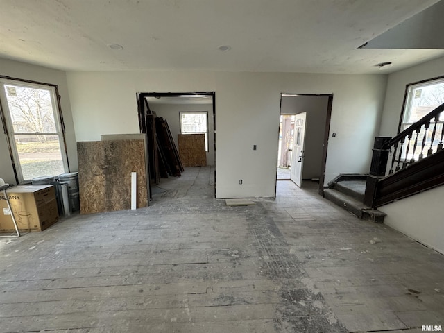 unfurnished living room featuring a wealth of natural light