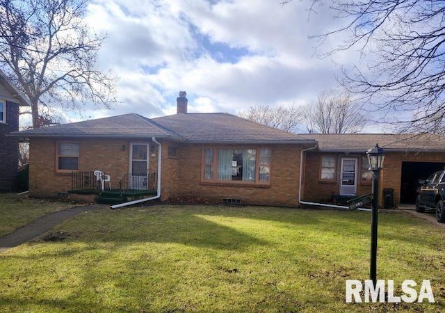 ranch-style home with a front lawn and a garage