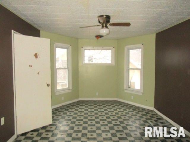 empty room featuring ceiling fan