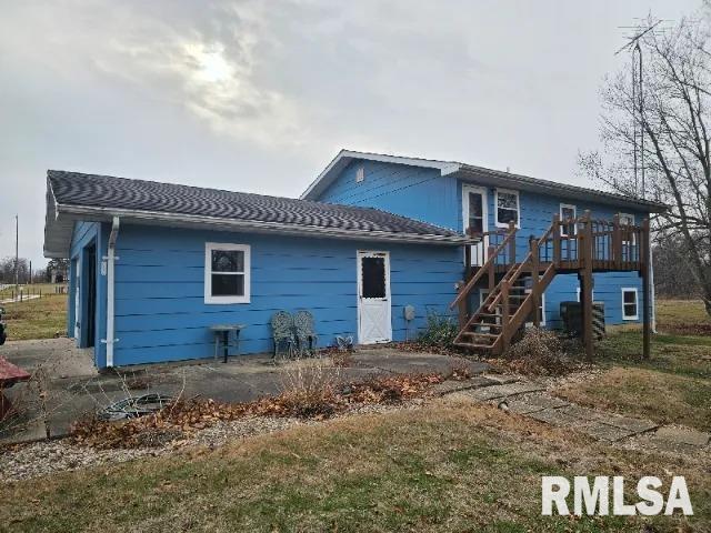 rear view of house with a wooden deck