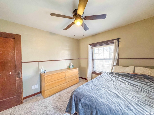 bedroom with ceiling fan and light colored carpet