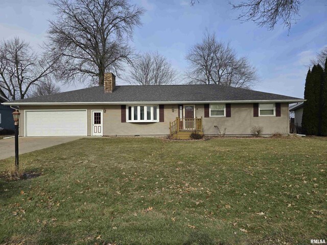 ranch-style home with a garage and a front lawn