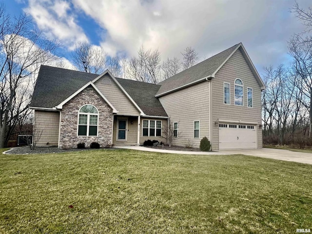 view of front of property featuring a garage and a front lawn