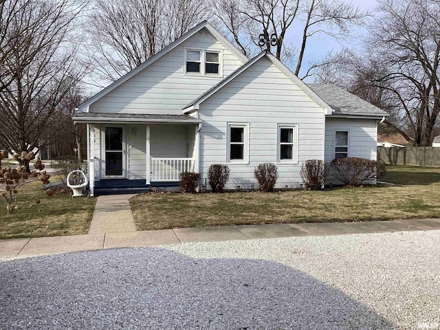 bungalow-style house with a porch and a front yard