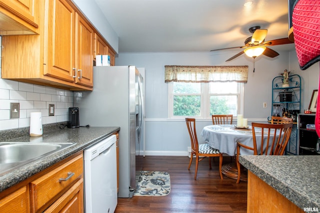 kitchen featuring dishwasher, dark hardwood / wood-style flooring, tasteful backsplash, and ceiling fan