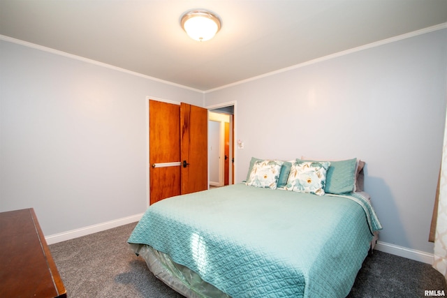 bedroom featuring dark colored carpet and crown molding