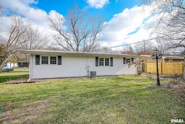 back of house with a yard