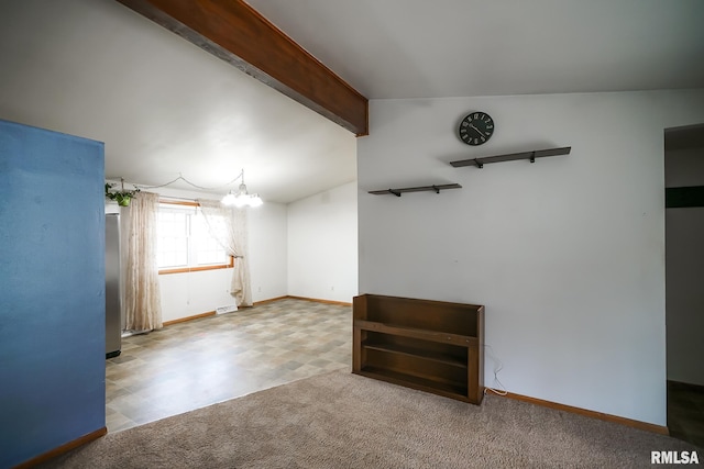 empty room featuring beam ceiling, carpet flooring, and a chandelier