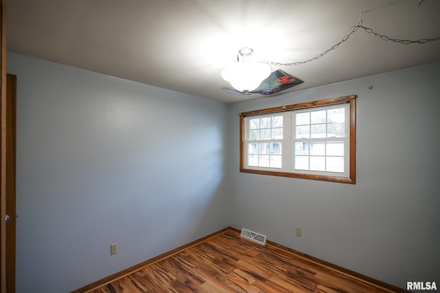 empty room featuring hardwood / wood-style flooring