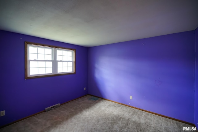 unfurnished room featuring carpet floors