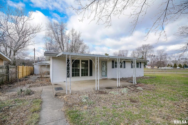 view of front of property with a front lawn and a patio area