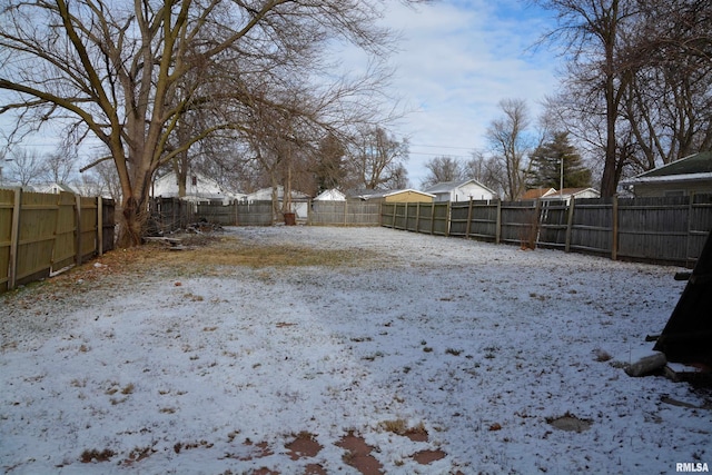 view of yard covered in snow