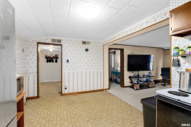 living room featuring light colored carpet and crown molding