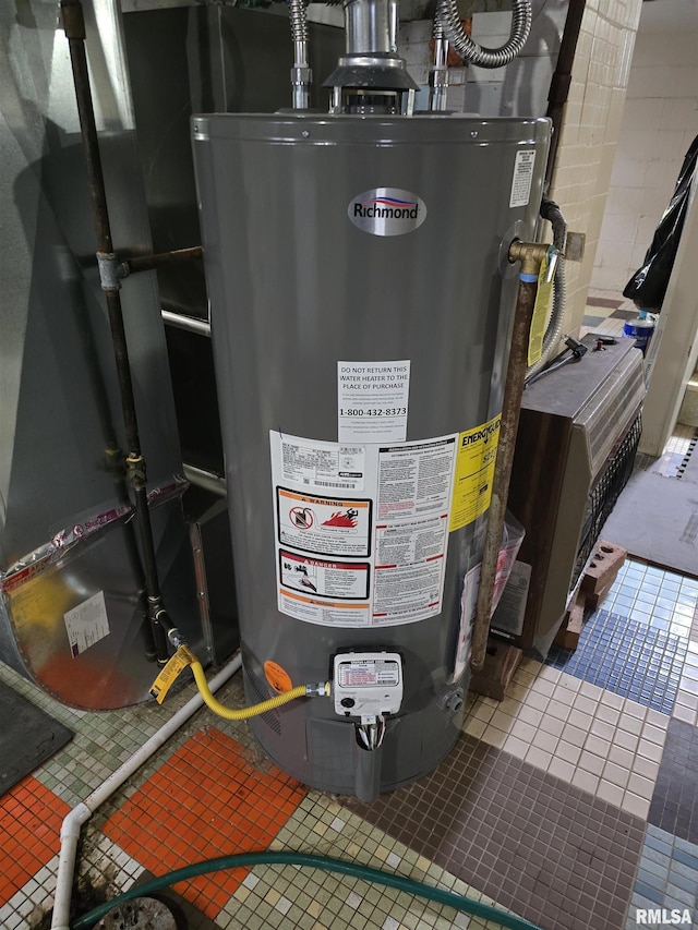 utility room featuring water heater