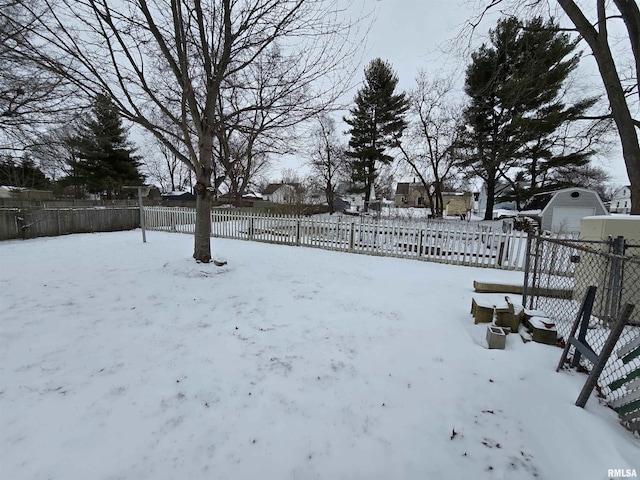 view of yard layered in snow