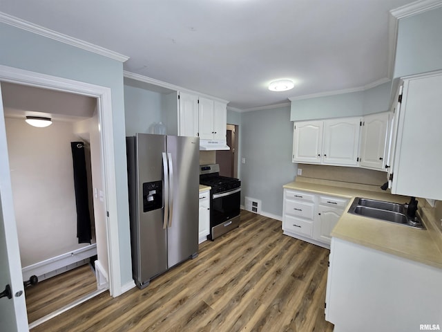 kitchen featuring white cabinets, crown molding, sink, and stainless steel appliances